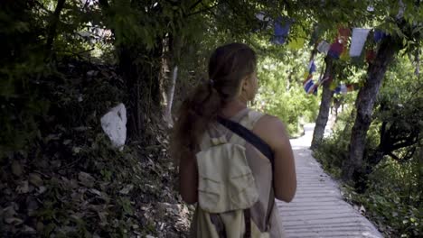 woman-walking-on-religion-footpath-around-temple