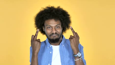 Afro-American-Man-Showing-Middle-Finger-on-Yellow-Background