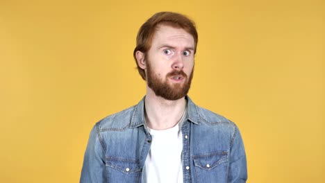 Fighting-Angry-Redhead-Man-Isolated-on-Yellow-Background