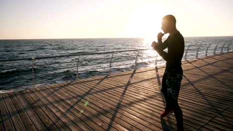 Man-Exercising-on-Seaside-Promenade