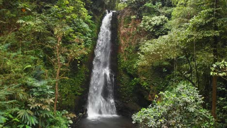 Waterfall-and-jungle-in-Bali,-Indonesia.-aerial-view-of-great-waterfall