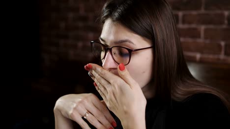 A-young-girl-works-at-the-computer.-Fatigue-during-operation-of-the-laptop.-Girl-yawning-while-working-at-the-computer.