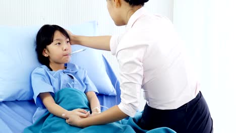 Little-girl-was-taking-care-by-her-mother-at-hospital.-People-with-Healthcare-and-Medical-Concept.