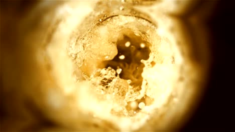 Closeup-slow-motion-pouring-beer-in-glass