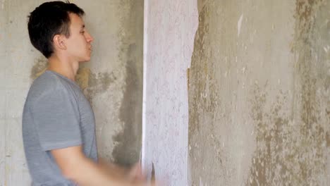 depressed-man-standing-and-beats-wall