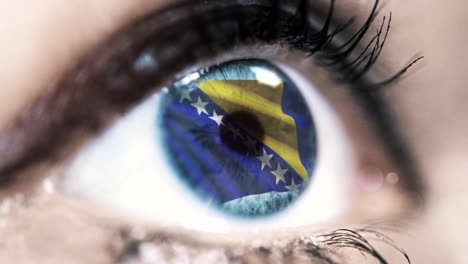 mujer-ojo-azul-en-primer-plano-con-la-bandera-de-Bosnia-y-Herzegovina-en-el-iris-con-el-movimiento-del-viento.-concepto-de-vídeo