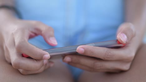 Closeup-Of-Hands-Of-Young-Woman-Using-Phone