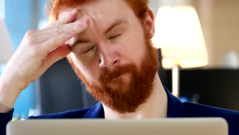 Tired-Man-working-on-Laptop,-Close-Up