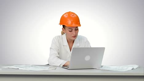 Angry-female-engineer-in-hardhat-with-documents-in-stress-because-of-result-on-white-background