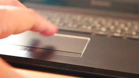 businessman-typing-on-a-laptop-keyboard-in-blurred-focus