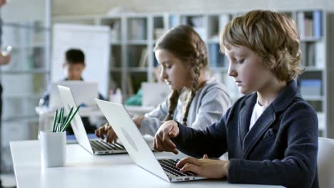 Children-Typing-on-Laptop-Computer