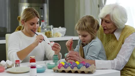 Family-Painting-Eggs-for-Easter-Holiday