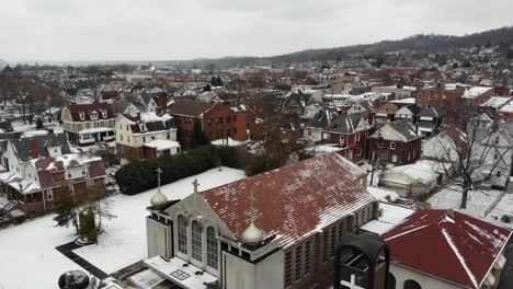 Slow-Forward-Aerial-Establishing-Shot-of-Small-Town-in-Winter