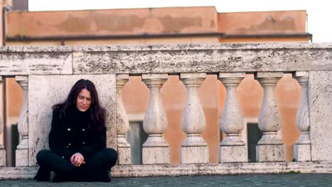 lonely-sad-young-brunette-crying-sitting-on-the-street