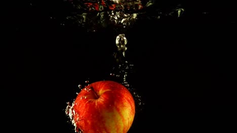 Falling-of-apples-in-water.-Slow-motion.