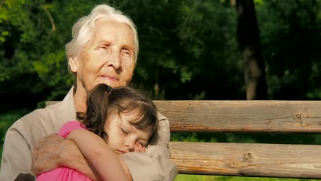 The-child-fell-asleep-at-the-grandmother's-hands.