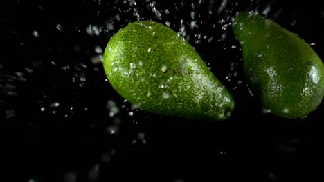 avocado-on-a-black-background.-Slow-motion.