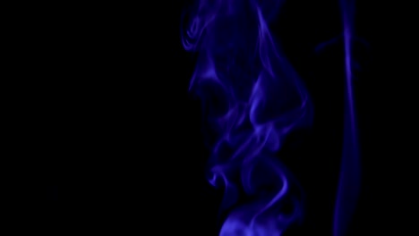 Blue-Steam-Rises-from-up.-Blue-smoke-over-a-black-background.-Smoke-slowly-floating-through-space-against-black-background.-Slow-Motion.