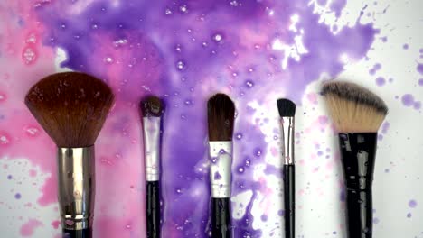 Splashes-paints-on-makeup-brushes-in-slow-motion