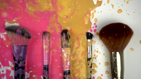 Splashes-paints-on-makeup-brushes-in-slow-motion