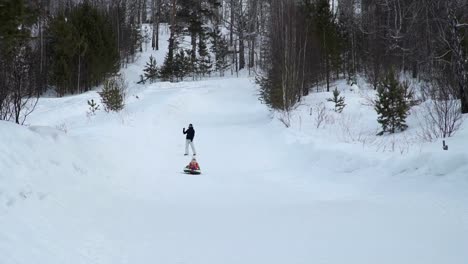 Little-Girl-Rides-on-a-Sledding-Tubing-from-Hill