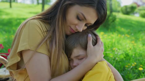 Mother-with-her-son-sleeping-in-her-arms