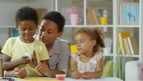 Boy-and-Girl-Making-Crafts-with-Clay