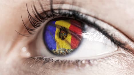 woman-green-eye-in-close-up-with-the-flag-of-Moldova-in-iris-with-wind-motion.-video-concept