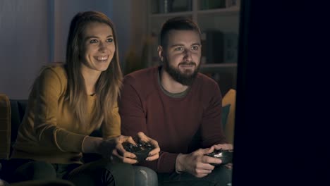 Happy-couple-playing-video-games-together