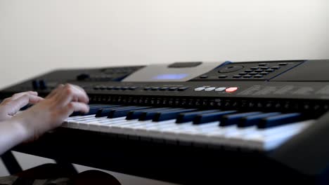 Little-girl-learning-to-play-the-piano.