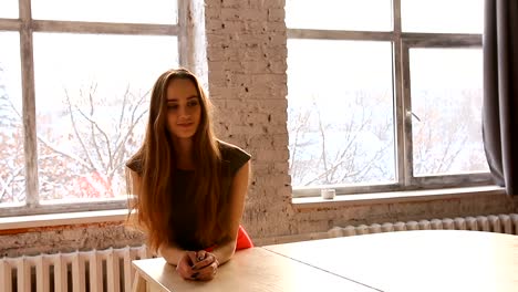 Attractive-young-woman-leaned-on-a-white-grand-piano