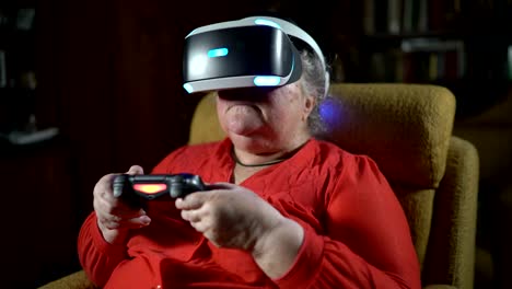 Elderly-woman-in-front-of-TV-screen-uses-VR-headset-and-wireless-gaming-controller