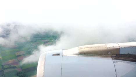 View-out-of-an-approaching-airliner-over-its-jet-engine