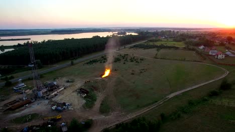 Aerial-shooting-Flaring-of-high-pressure-gas-from-the-gas-well-at-sunset.