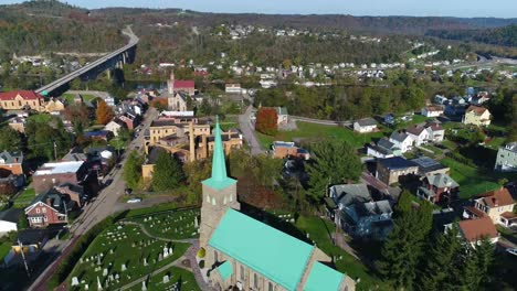 Morning-Exterior-Reverse-Aerial-Establishing-Shot-of-Brownsville-Pennsylvania