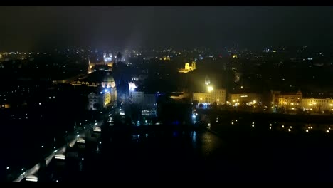 Night-panorama-of-Prague,-panoramic-view-from-the-air-to-the-old-town,-lights-of-the-night-city,-Prague