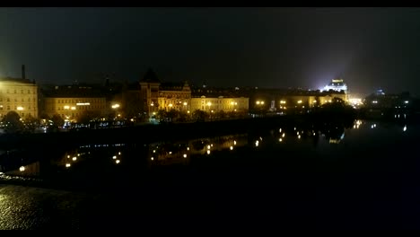 Night-panorama-of-Prague,-panoramic-view-from-the-air-to-the-old-town,-lights-of-the-night-city,-Prague