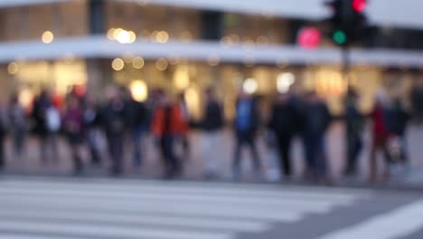 Pedestrians-crossing-street-at-zebra-crossing.-People-passing-by.