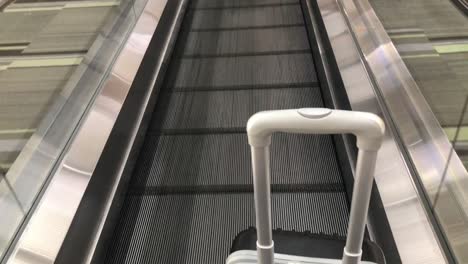 Travel-bag-on-travelator-or-slide-way-in-airplane