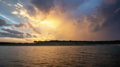 Time-Lapse-of-Large-Clouds-Moving-Away-During-Sunset