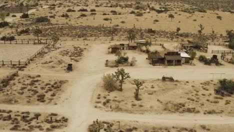 Flying-over-trees-and-houses-in-the-desert.