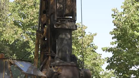 Construction-drill-auger-working-in-the-countryside