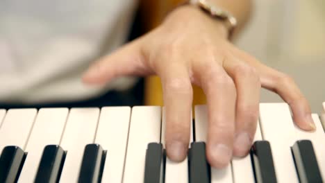 young-male-musician-playing-keyboard