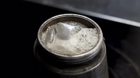 Close-Up-of-a-herbal-tea-bubbles-inside-a-moka-pot