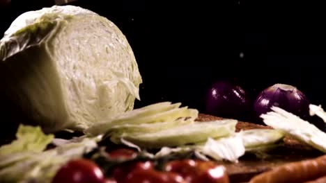 Cutting-cabbage-with-knife-on-the-wood.-Slow-motion-480-fps