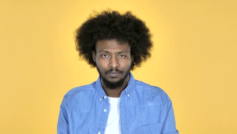 Sad-Upset-Afro-American-Man-on-Yellow-Background