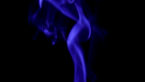 Blue-Steam-Rises-from-up.-Blue-smoke-over-a-black-background.-Smoke-slowly-floating-through-space-against-black-background.-Slow-Motion.