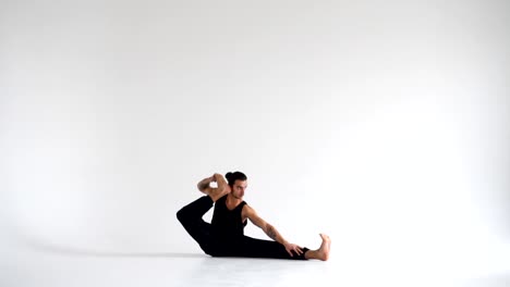 Man-practicing-intense-yoga-asana