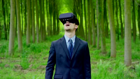 young-nice-man-using-3d-reality-in-life-with-oculus-and-augmented-reality-technology-with-implements-of-reality.