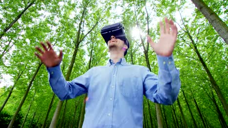 young-nice-man-using-3d-reality-in-life-with-oculus-and-augmented-reality-technology-with-implements-of-reality.